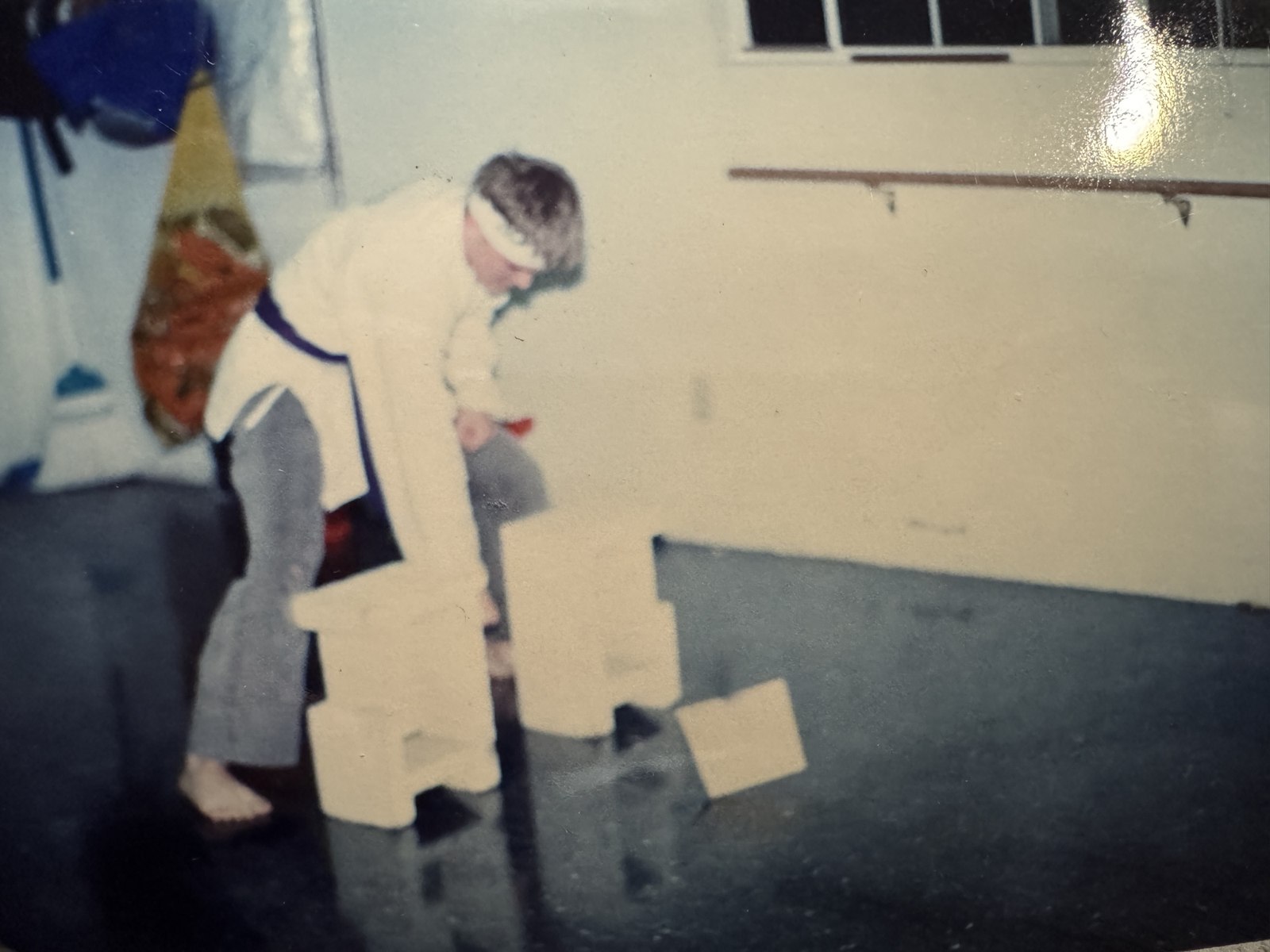 A young Shaun Anderson being promoted in rank by his instructor
