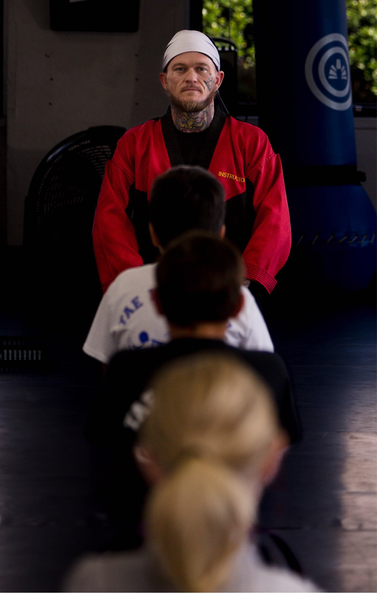 Students bowing to instructor Shaun Anderson in class